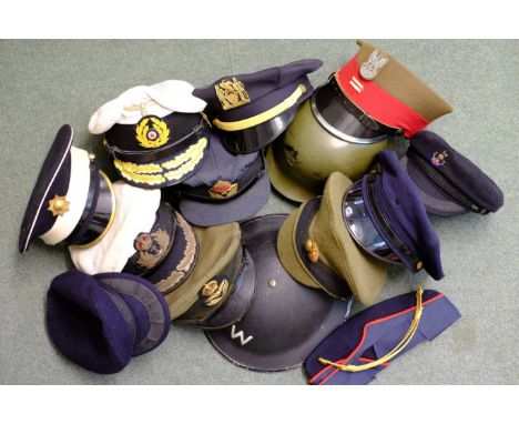 *Military hats. A collection of WWII and later hats including a W.R.A.F. cap with King's crown,  brass eagle, lining with lab