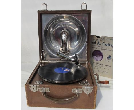 *Portable Gramophone. A 1930/40s Decca gramophone with winding handle and other accessories in a brown leatherette carrying c