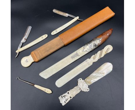 A Lot of letter openers and cut throat razors. Includes Hand carved mother of pearl , Leather handle, white metal and ivory p