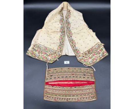 A 19th century silk and needle work waistcoat  together with a needlework style cushion. Chinese baby silk shoes and Chinese 