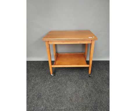 A Light oak two tier games table trolley. Produced by Eastcraft Scotland [63x65x45cm] 