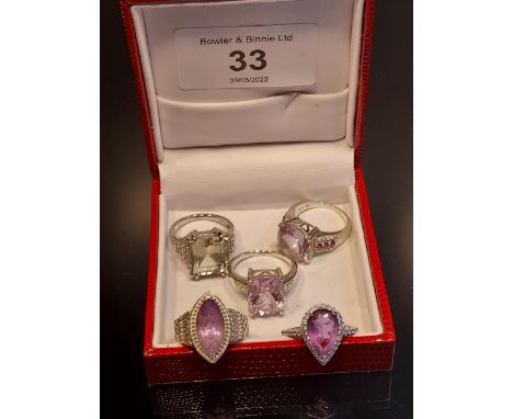 A Lot of five ladies 925 silver rings. Four 925 silver and Amethyst stone set rings [Ring size J &amp; K], and 925 silver and