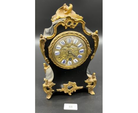 A 19th century mantel clock detailed with brass ormalu mounts, brass and enamel face. [27cm high] [No Key] 