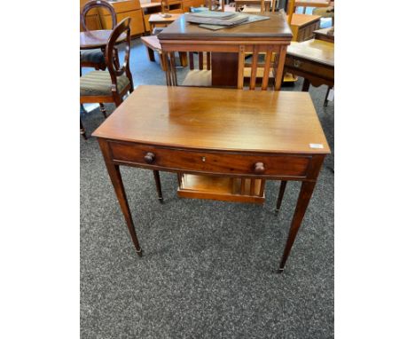 Georgian console, the rectangular top with bow front, above a single frieze drawer, raised on square tapered legs [75.5x79x47