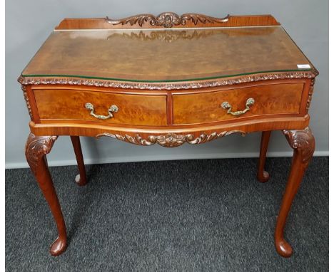 Antique style burr walnut console, the raised back with carved moulded detail, above a rectangular surface with glass top and