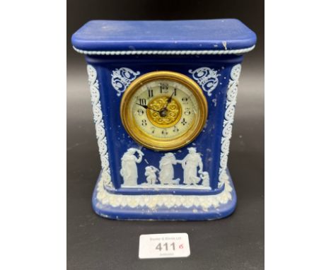 A Vintage Wedgwood Jasper clock. Designed with a brass and enamel clock face. [15cm high] 