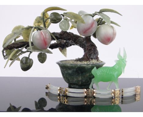 An oriental hardstone tree,a goat, height 3.5" and a jade bracelet, (3).