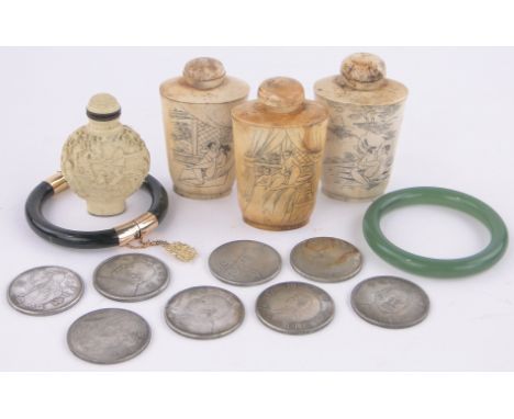 A group of Oriental items,including 2 Chinese green jade bangles, 3 erotic bone snuff bottles, Chinese coins, etc.