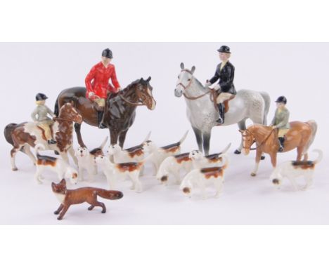 A Beswick fox hunting set,comprising huntsman and woman, 2 children, 9 hounds and fox, (14).