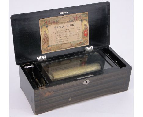 A 19th century Swiss rosewood and marquetry inlaid musical box,playing 6 tunes on an 8.25" cylinder, some teeth missing, leng