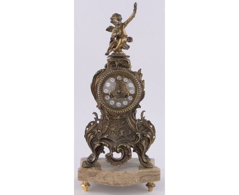 An ornate French gilt  brass cased mantel clock in Rococo style,surmounted by a cherub on coloured marble plinth, height incl