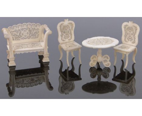 4 Pieces of 19th century South German carved and pierced bone dolls house furniture,with pierced fretwork decoration, sofa le
