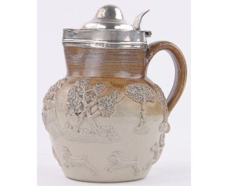 A Georgian silver mounted salt glazed hunting flagon,with relief decorated scenes and hinged lid, height 7".