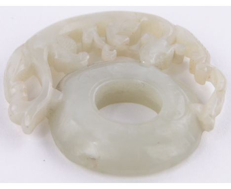 A Chinese carved jade disc with dragon mount,height 2".