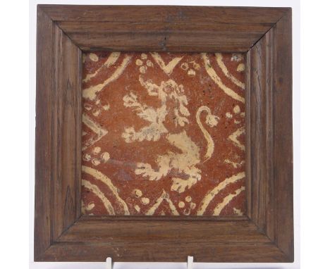 A European framed 16th century tile,with painted design of a lion, 7.25" across overall.