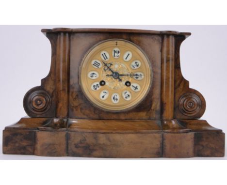 A 19th century French walnut cased mantel clock,with gilded and enamelled dial, in carved and moulded case, height 8.5", leng