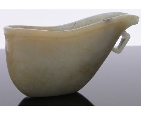 A Chinese green jade libation cup,with integral handle, length 4".