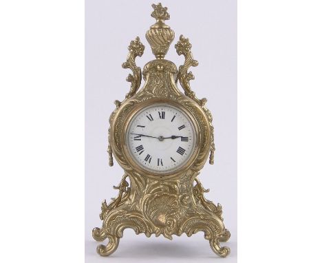 A French gilt brass cased mantel clock in Rococo style,with enamelled dial, height 13".