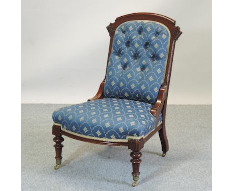 A Victorian mahogany and blue upholstered button back nursing chair