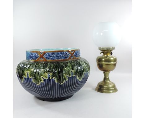 A large pottery jardiniere, 30cm high, together with a brass oil lamp