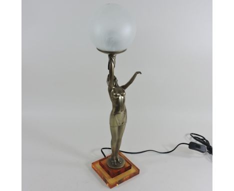 An Art Deco style figural table lamp, with a white glass shade, 58cm high overall