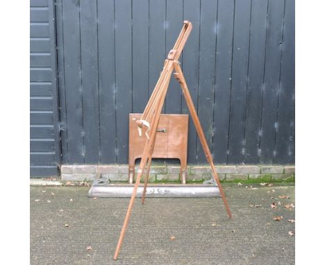 A Victorian brass fender, 125cm, together with a copper fire guard and an easel