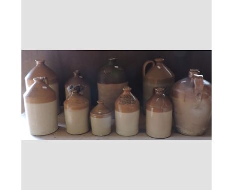 A collection of stoneware advertising jars, highest 41cm, together with a vintage meat grinder