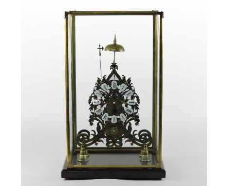 A brass skeleton clock, the enamel dial with Arabic hours, striking on a bell, in a glazed display case, 53cm high