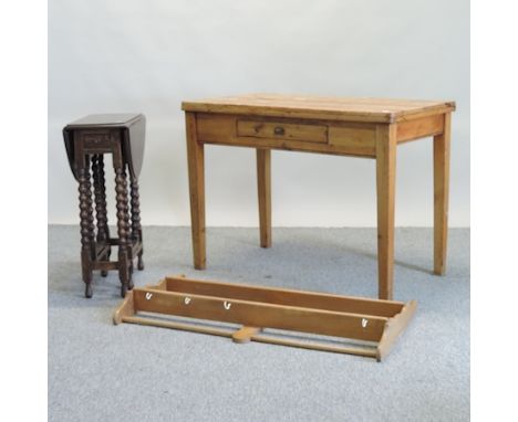 A pine kitchen table, with a single drawer, on square tapered legs, 106cm, together with a small oak gateleg table, an Ercol 