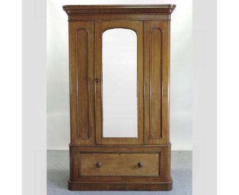 A Victorian mahogany single wardrobe, with a mirrored door, 124cm