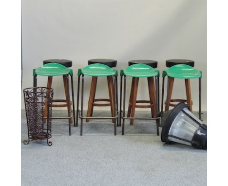 A set of four black upholstered stools, together with a set of metal framed stools, a lantern and an stick stand