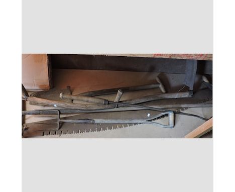 A collection of vintage farm tools