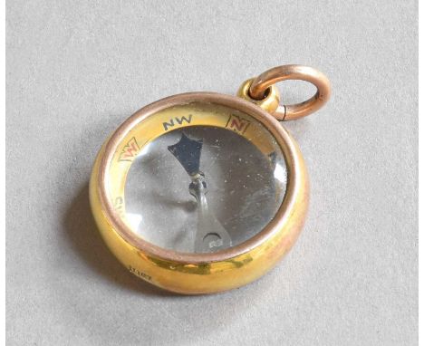 A Gold-Cased Compass, Stamped '10ct', First Quarter 20th Century, circular, with a glazed panel on each side, with direction 