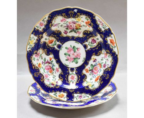 A Pair of Bloor Derby Plates, circa 1830, painted with flowers on a blue scale ground, 23cm diameter (2)