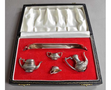 A Cased Four-Piece Elizabeth II Miniature Toy Silver Tea-Service With a Tray En Suite, by P. H. Vogel and Co., Birmingham, 19