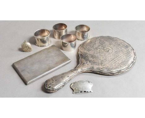 A Collection of Assorted Silver, comprising: an engine-turned cigarette-case; four differing napkin-rings; a decanter-label, 