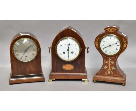 An Edwardian Mahogany Inlaid Mantel Timepiece, together with an Edwardian mahogany shell inlaid striking mantel clock, a simi