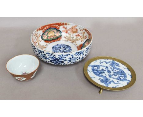 A Japanese Meiji Period Imari Bowl, 19cm diameter, together with a Chinese Cafe au Lait ground teabowl and a Kangxi blue and 