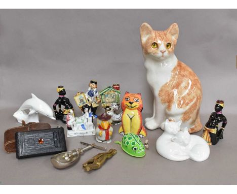 A Winstanley Pottery Cat, together with a pair of Royal Doulton cats, a Lorna Bailey cat, Poole dolphin, four small flasks, a