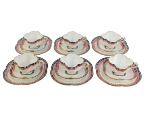 A Coalport porcelain tea service, for six place settings, comprising teacups, saucers and side plates, each of shaped design 