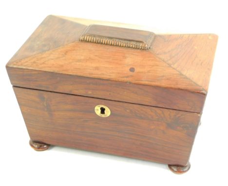 A Regency rosewood sarcophagus shaped tea caddy, the hinged lid enclosing two lidded compartments, on compressed bun feet, 13