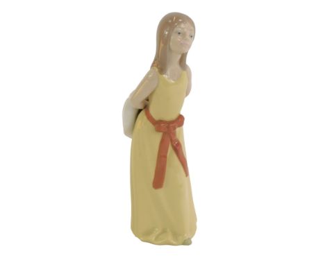 A Lladro porcelain figure, modelled as a young girl with arms clasp behind back holding hat, printed marks, 24cm high.