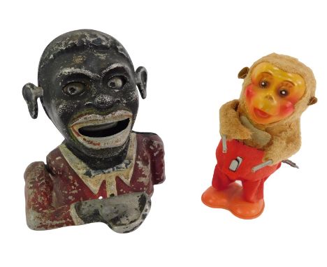 A 20thC Hong Kong clockwork windup toy, modelled as a monkey, impressed mark to underside, Made in Hong Kong, 14cm high (AF),