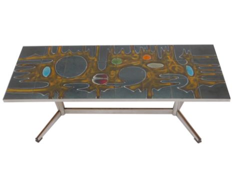 A 1970s chrome framed tile top coffee table, the top decorated with an abstract roundel and drip design in yellows, blues, gr