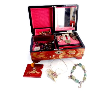 An Oriental painted jewellery box and contents, comprising threepence piece bracelet, costume necklace, scarf clip, dress rin