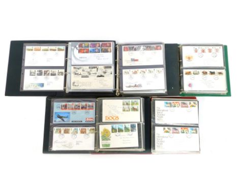 Five albums containing first day covers, to include St John Ambulance, Flowers, Christmas 1986, Heraldry, Fishing, some loose