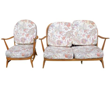 An Ercol elm framed suite, comprising two seater sofa and armchair, model number 203, with removable back and seat cushions, 