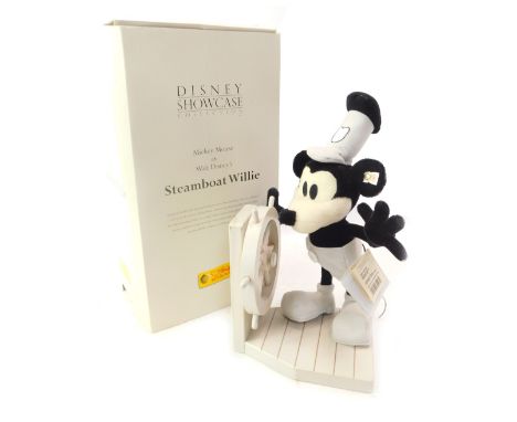 A Steiff Mickey Mouse as Steamboat Willie mohair soft toy, number 4400, 22cm high, together with a wooden ship's wheel, boxed