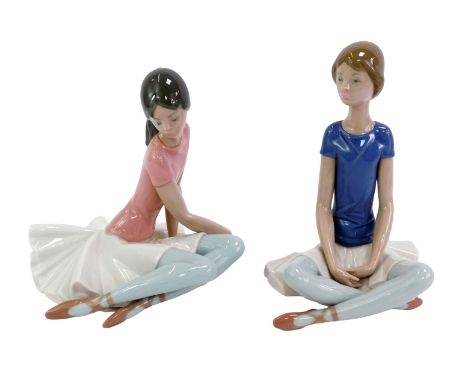 Two Lladro porcelain figures, each modelled as a seated ballerina, printed marks, 21.5cm and 18cm high respectively, one boxe