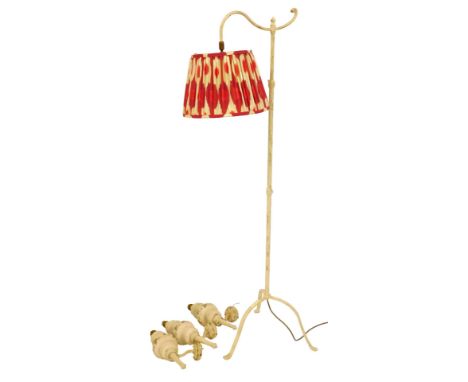 A 20thC painted brass standard lamp, the pink and cream pleated shade, 132cm high, together with a set of three white painted